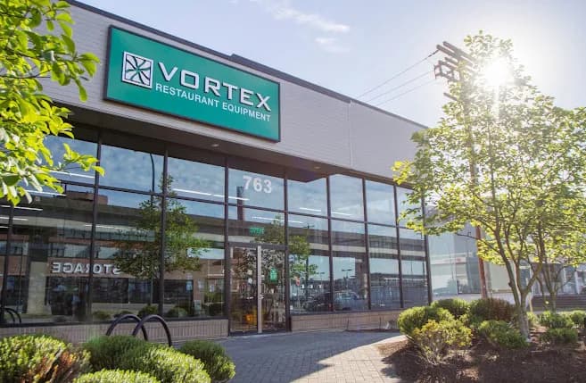 The Vortex Restaurant Equipment showroom from the street, its green sign above the glass frontage