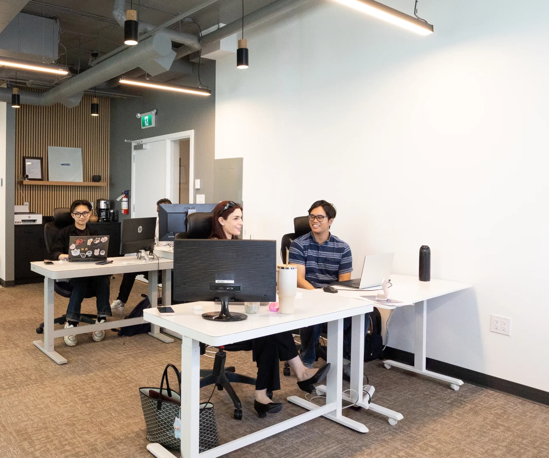 Developers working at their desks.